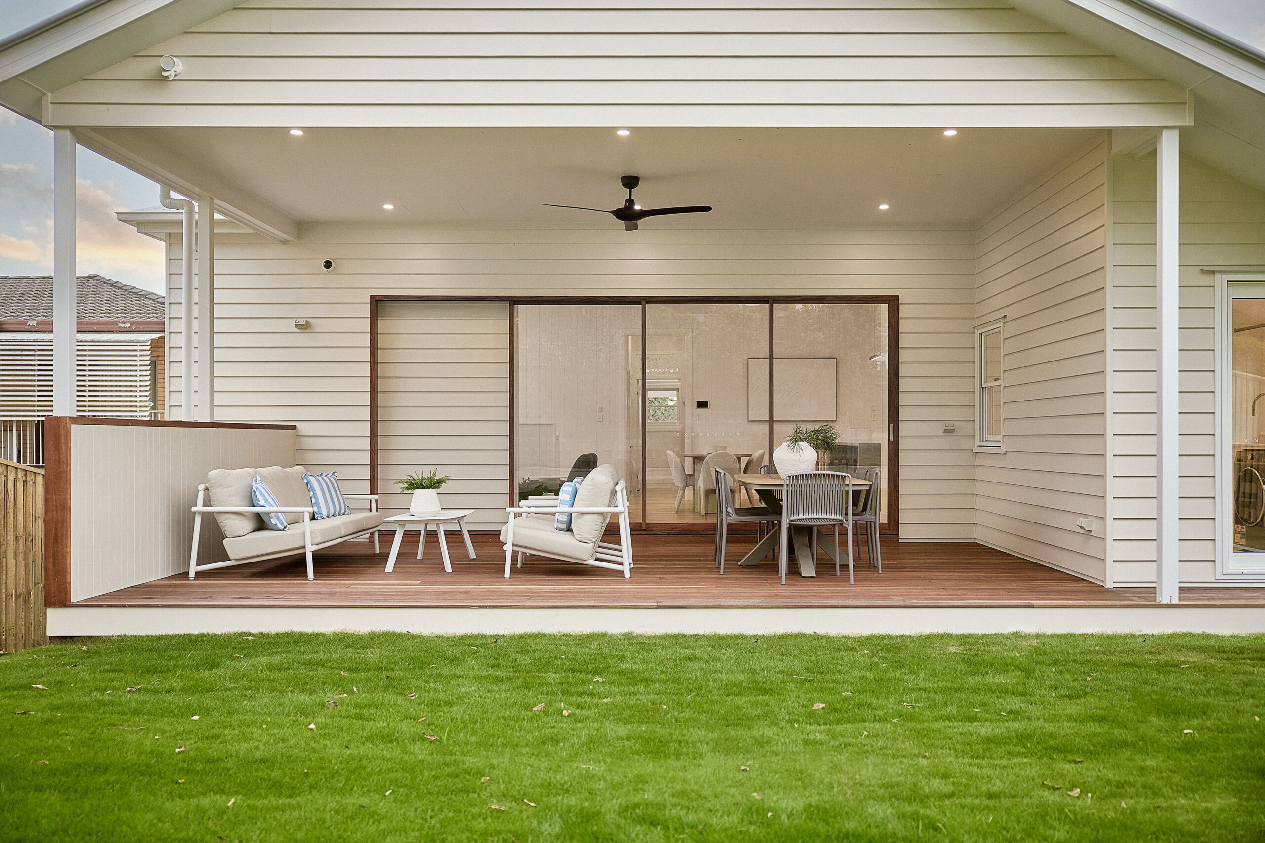 Modern outdoor living space with a patio area and dining table.