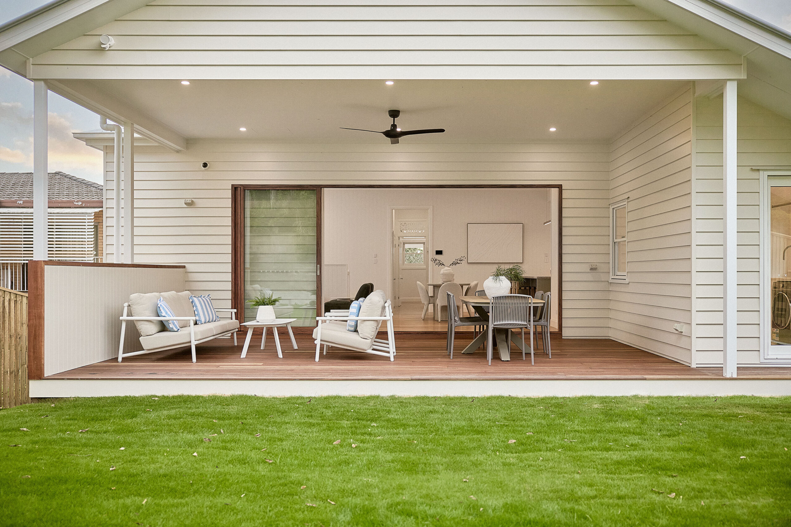 Modern outdoor living space with a patio area and dining table.